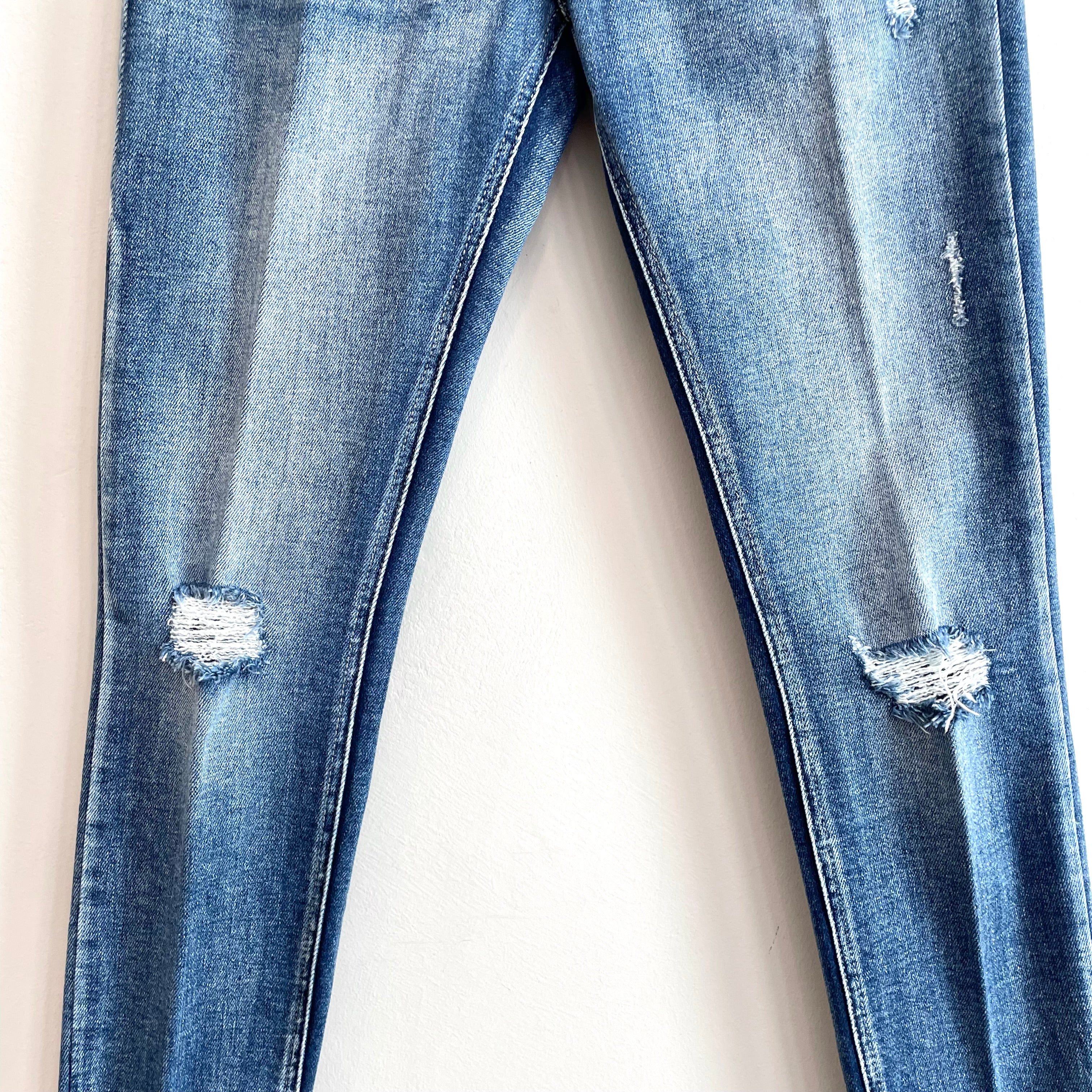 Distressed Mid Rise Skinny Jeans