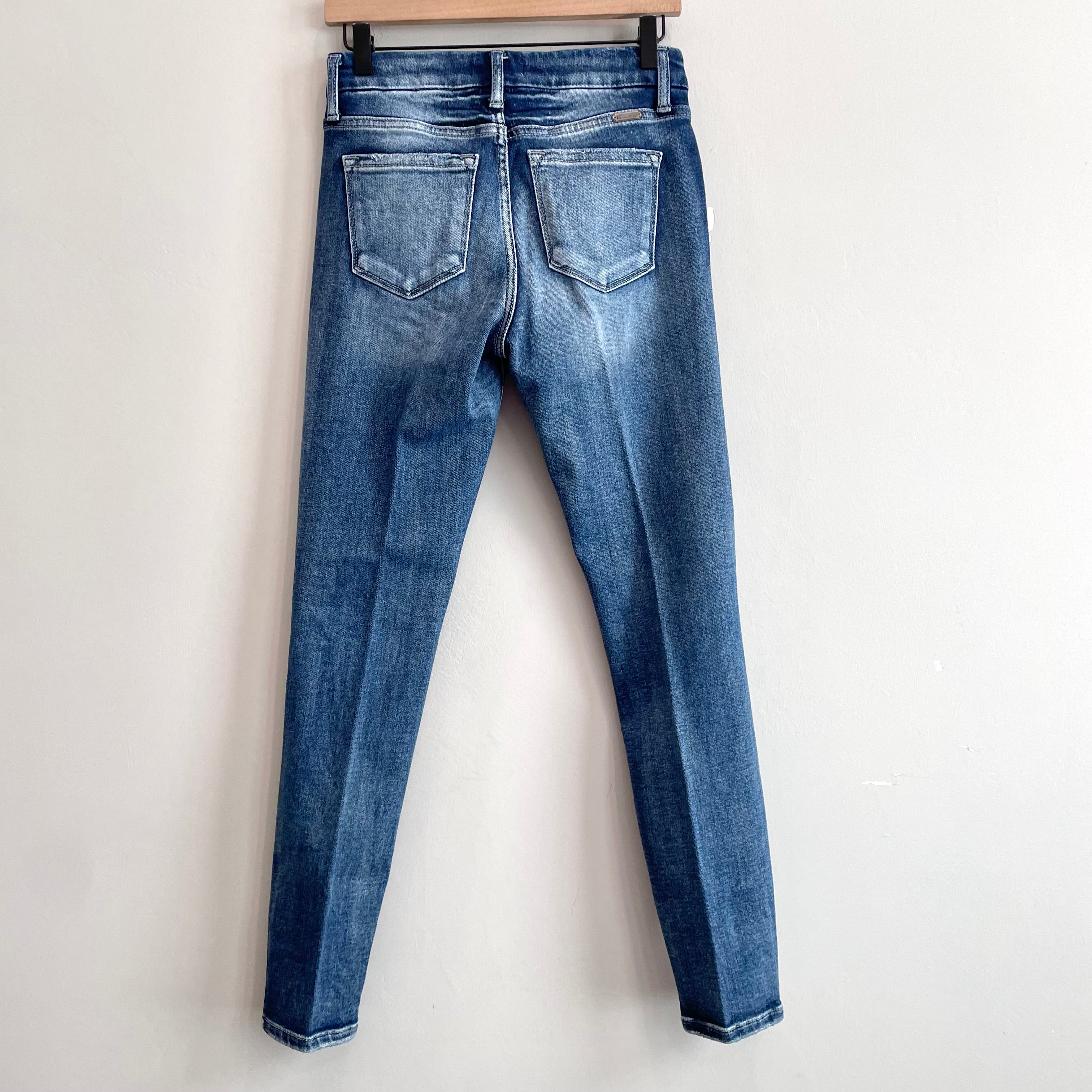 Distressed Mid Rise Skinny Jeans